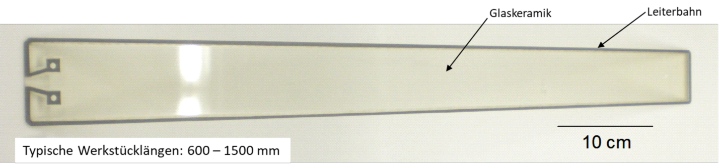 Bild 1: Beschichtetes Glaskeramikfenster mit umlaufender, thermisch gespritzter Leiterbahn als Bruchdetektor.